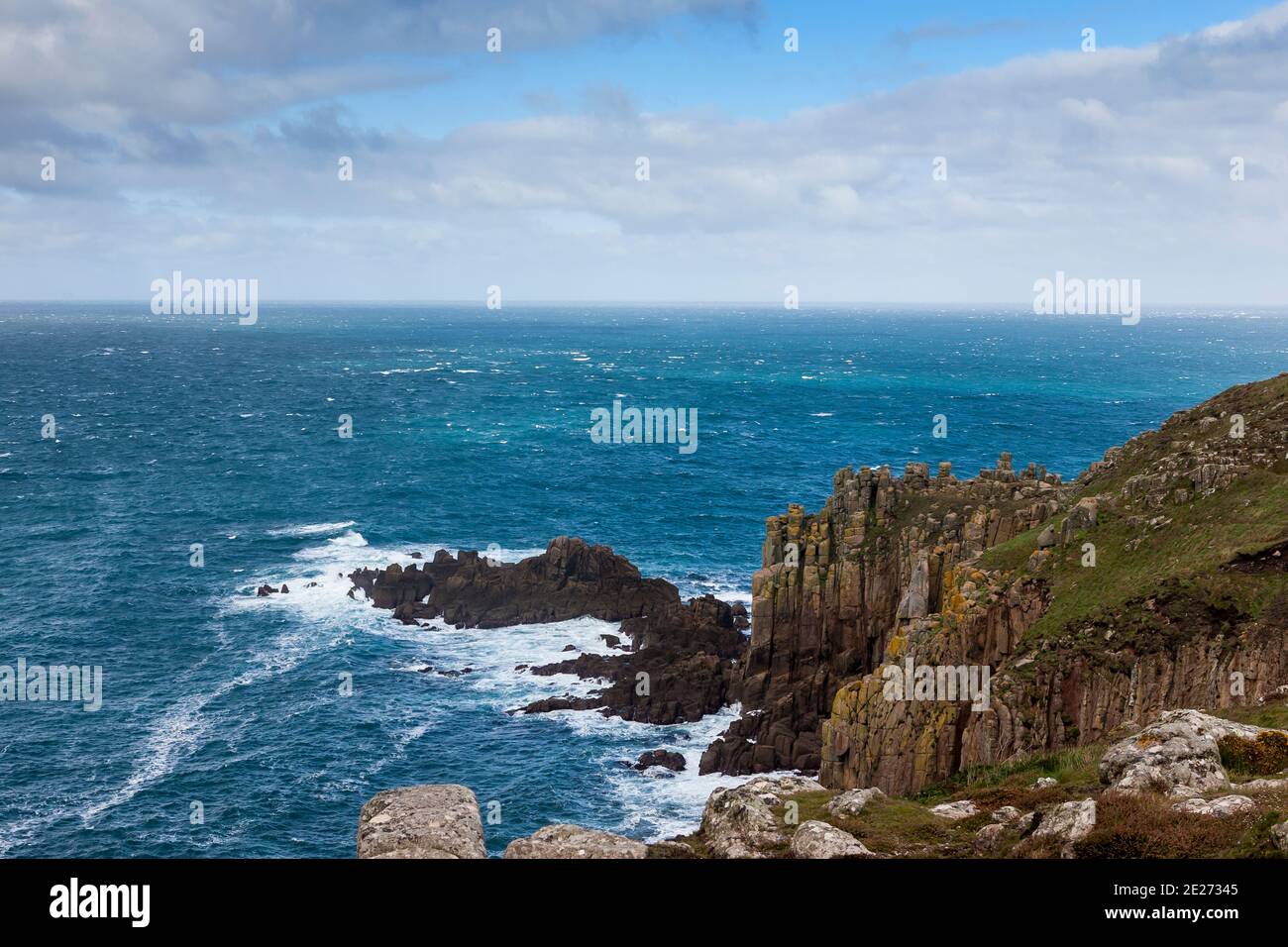 Gale blowing at Dr. Syntax's Head, Land's End, Cornwall, England, UK Stock Photo