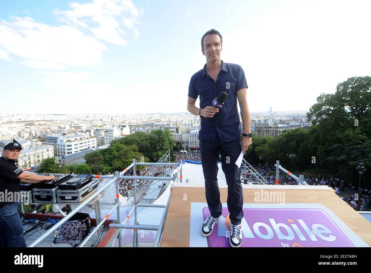 TV Anchor Stephane Rotenberg presents the World roller champion Taig Khris breaks the long jump world record from the top of Paris' Butte Montmartre in Paris, France on Saturday, July 2nd, 2011, Seen here is with his mother Aleka the sportsman dashes down from the Sacre Coeur in Montmartre and he smashes the long jump world record in roller (29m). Photo by ABACAPRESS.COM Stock Photo