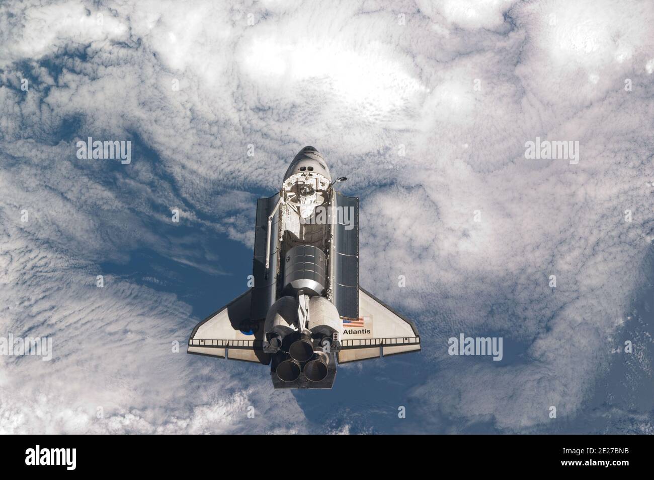 The space shuttle Atlantis is pictured over clouds prior to a perfect ...