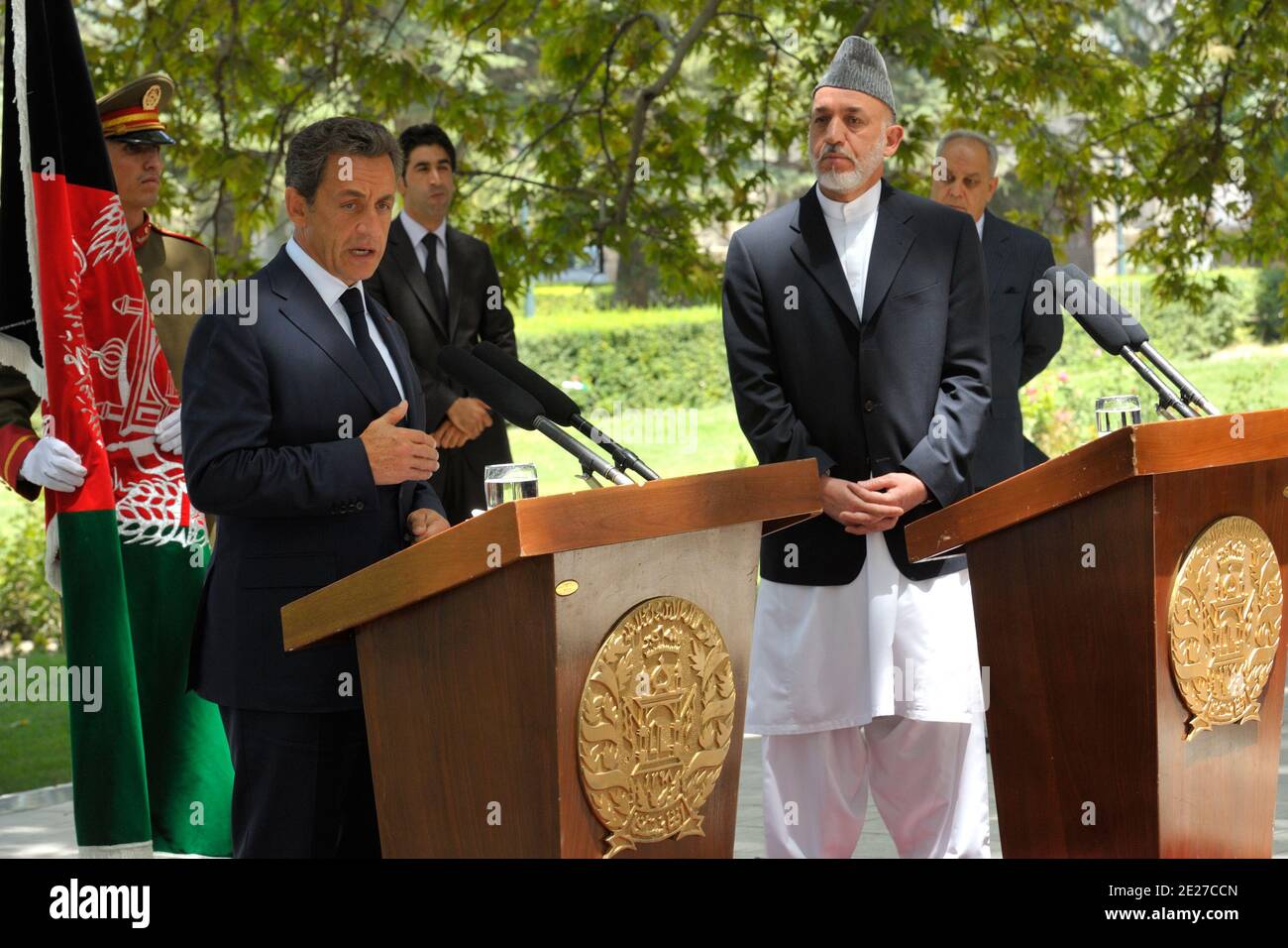 Afghanistan's President Hamid Karzai (R) listens to his French counterpart Nicolas Sarkozy during a news conference after Karzai's brother was shot killed in Kandahar province, at the presidential palace in Kabul July 12, 2011. Ahmad Wali Karzai, a brother of Afghan President Hamid Karzai, and one of the most powerful men in southern Afghanistan, was shot dead on Tuesday, apparently by one of his bodyguards. Photo by Philippe Wojazer/Pool/ABACAPRESS.COM Stock Photo