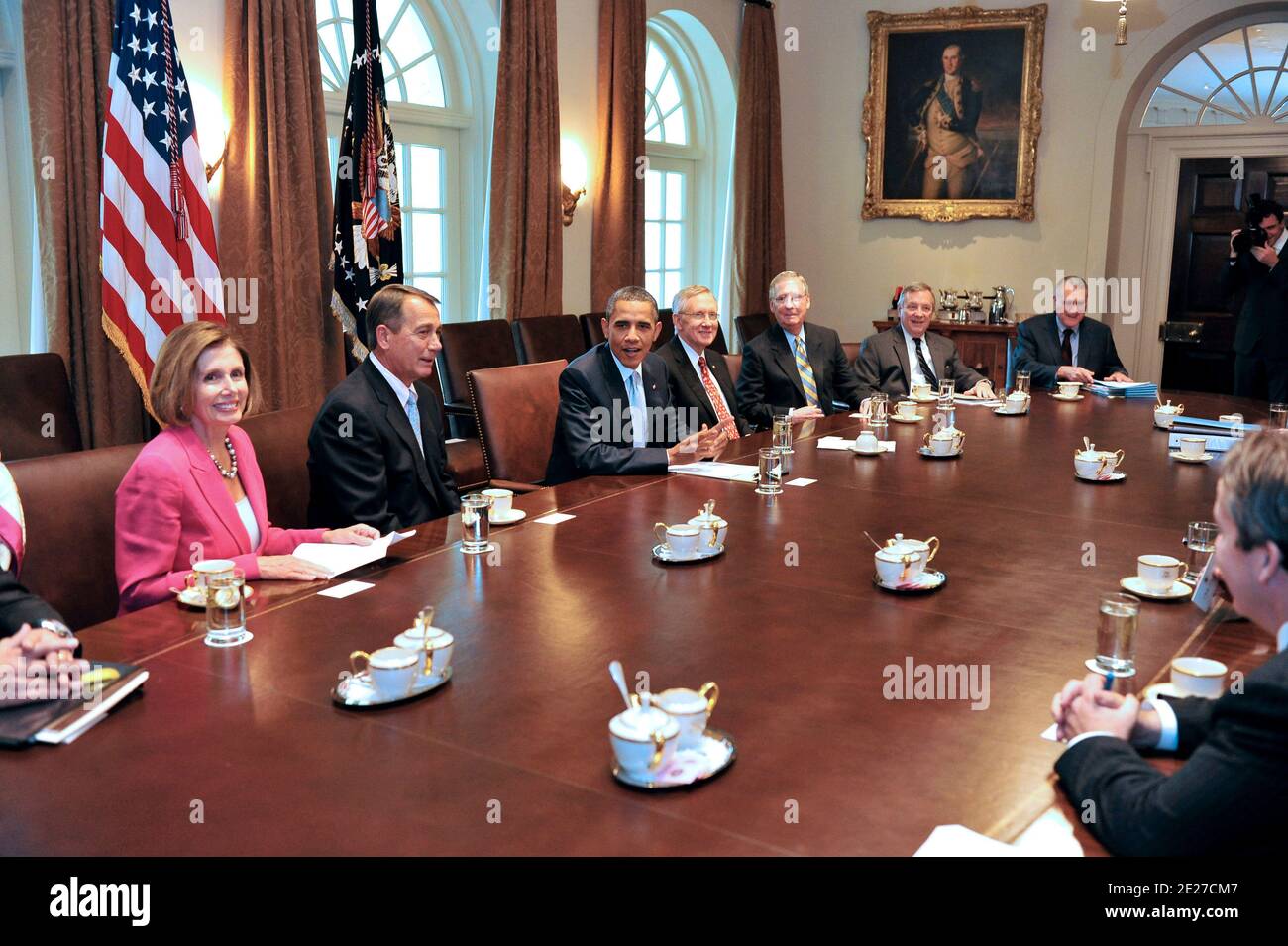 United States President Barack Obama during a photo-op with bipartisan Congressional Leadership in the Cabinet Room of the White House in Washington, D.C., on July 13, 2011, prior to a meeting to discuss the ongoing efforts to find a balanced approach to deficit reduction. From left to right: U.S. House Minority Leader Nancy Pelosi (Democrat of California); Speaker of the U.S. House of Representatives John Boehner (Republican of Ohio); President Obama; U.S. Senate Majority Leader Harry Reid (Democrat of Nevada); U.S. Senate Republican Leader Mitch McConnell (Republican of Kentucky); U.S. Senat Stock Photo
