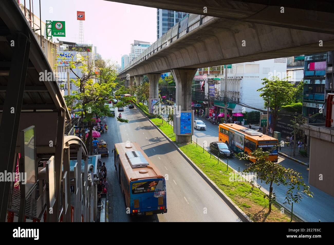 Bangkok, Thailand - March, 2015: Bangkok city downtown transportation. Concrete metro bridge, pedestrian overhead passage and road highway Stock Photo