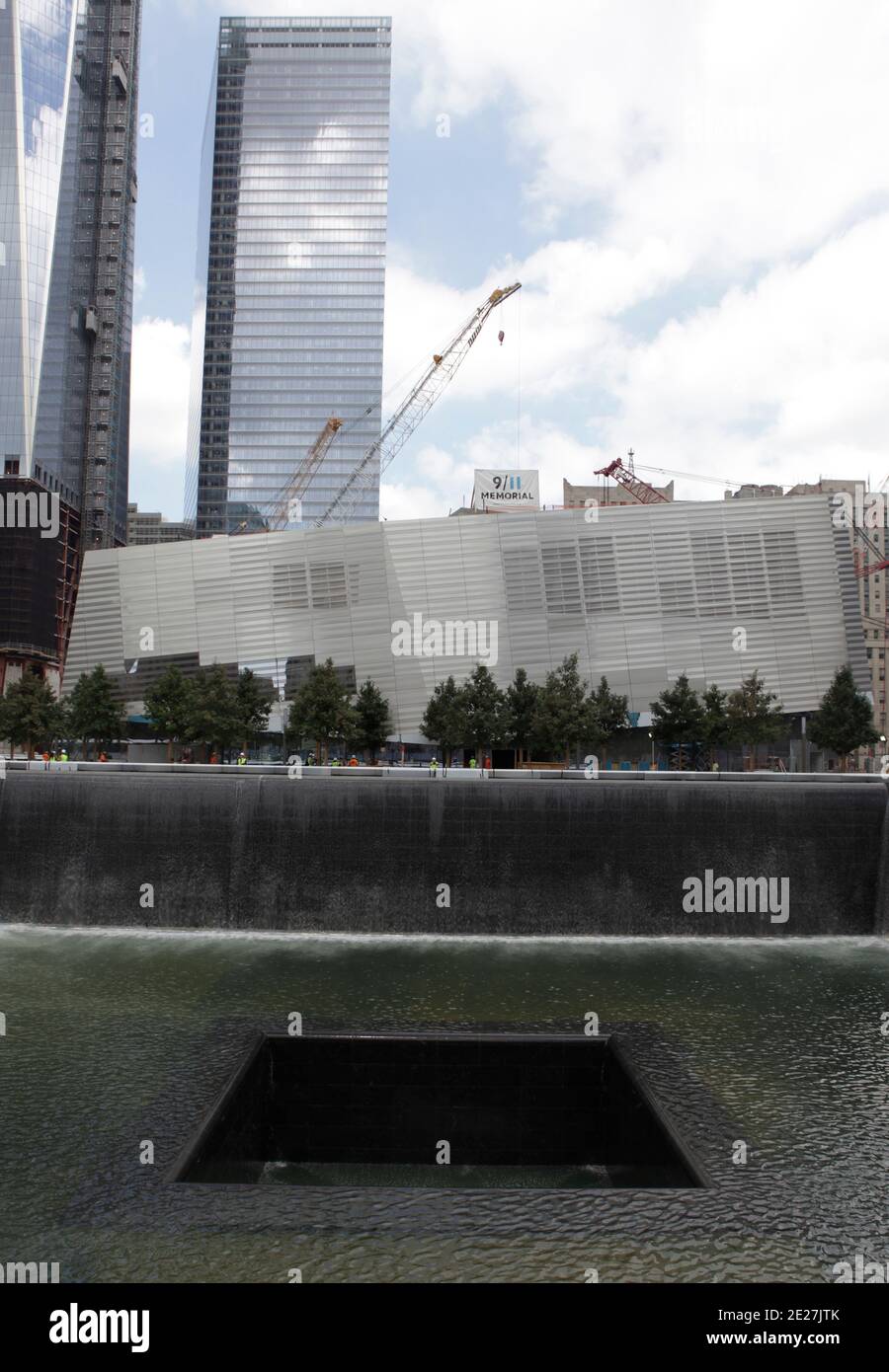 The 9/11 Memorial Pools are tested with water by construction workers ...