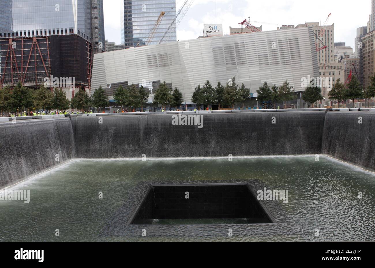 The 9/11 Memorial Pools are tested with water by construction workers ...