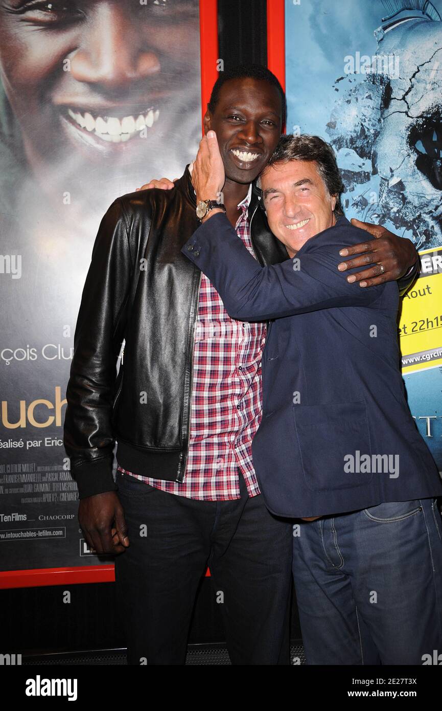 Omar Sy and Francois Cluzet attending the premiere of 'Intouchable' prior the opening ceremony of the 4th Festival Du film Francophone d'Angouleme in Angouleme, France on August 24, 2011. Photo by Giancarlo Gorassini/ABACAPRESS.COM Stock Photo