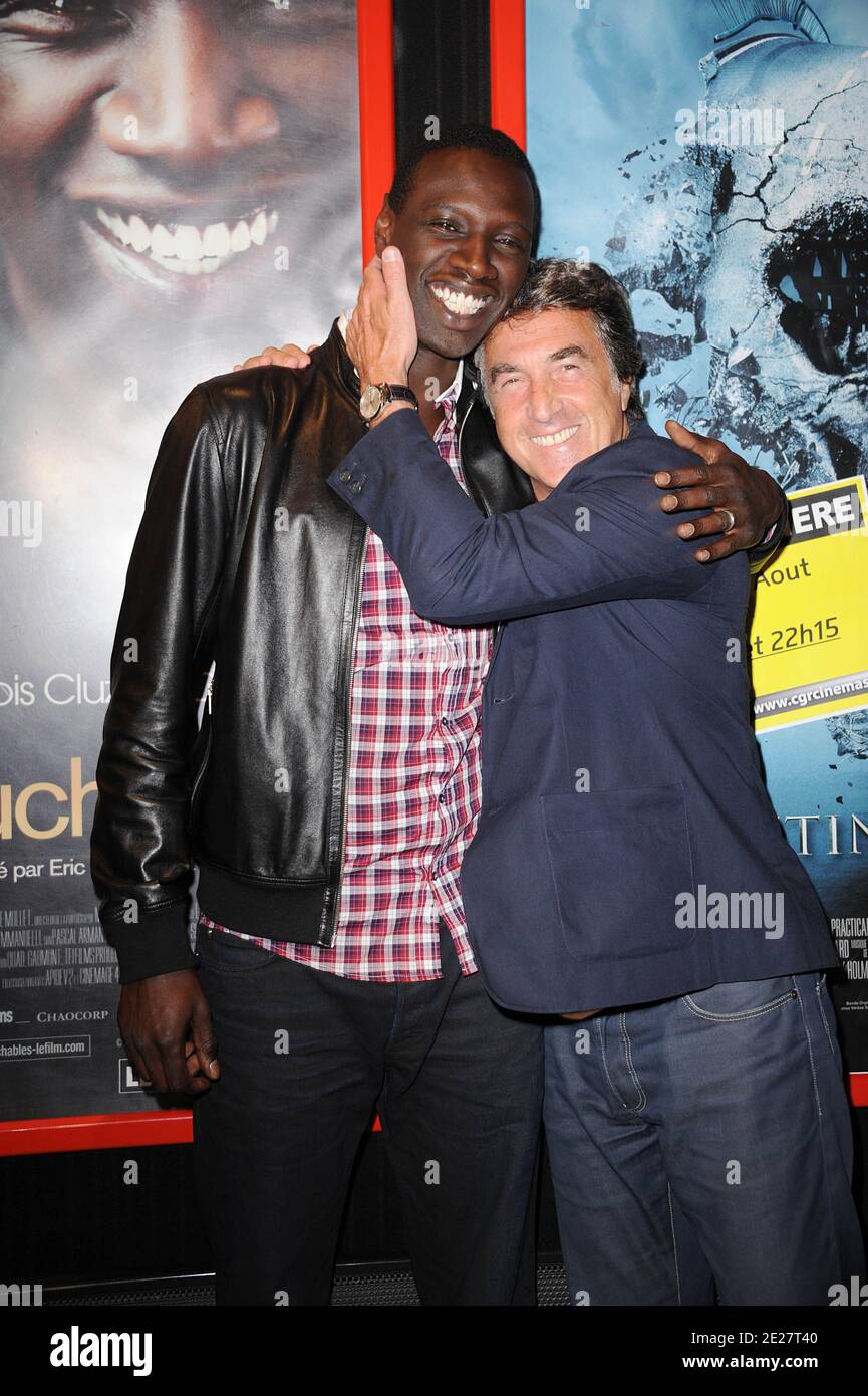 Omar Sy and Francois Cluzet attending the premiere of 'Intouchable' prior the opening ceremony of the 4th Festival Du film Francophone d'Angouleme in Angouleme, France on August 24, 2011. Photo by Giancarlo Gorassini/ABACAPRESS.COM Stock Photo