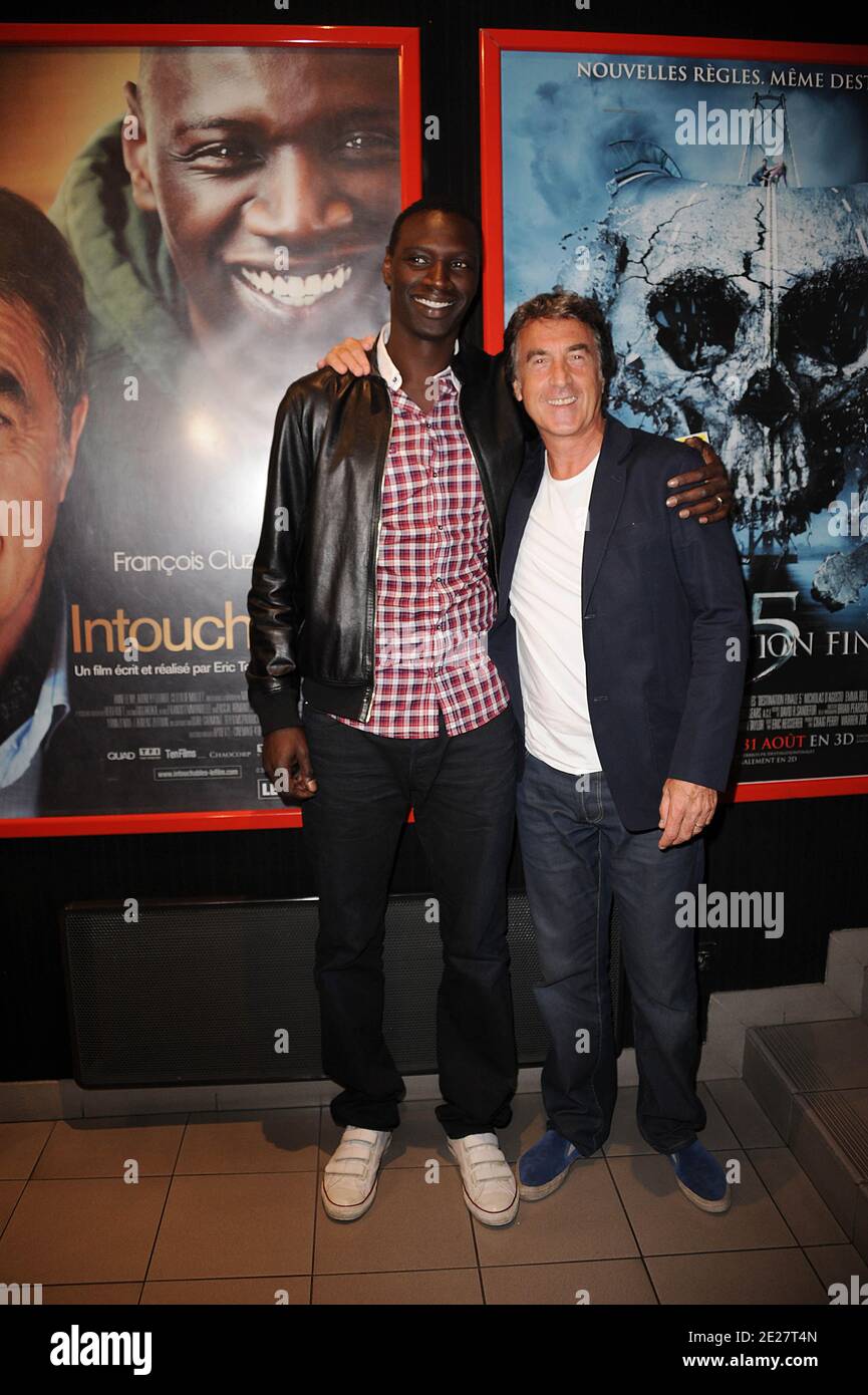 Omar Sy and Francois Cluzet attending the premiere of 'Intouchable' prior the opening ceremony of the 4th Festival Du film Francophone d'Angouleme in Angouleme, France on August 24, 2011. Photo by Giancarlo Gorassini/ABACAPRESS.COM Stock Photo