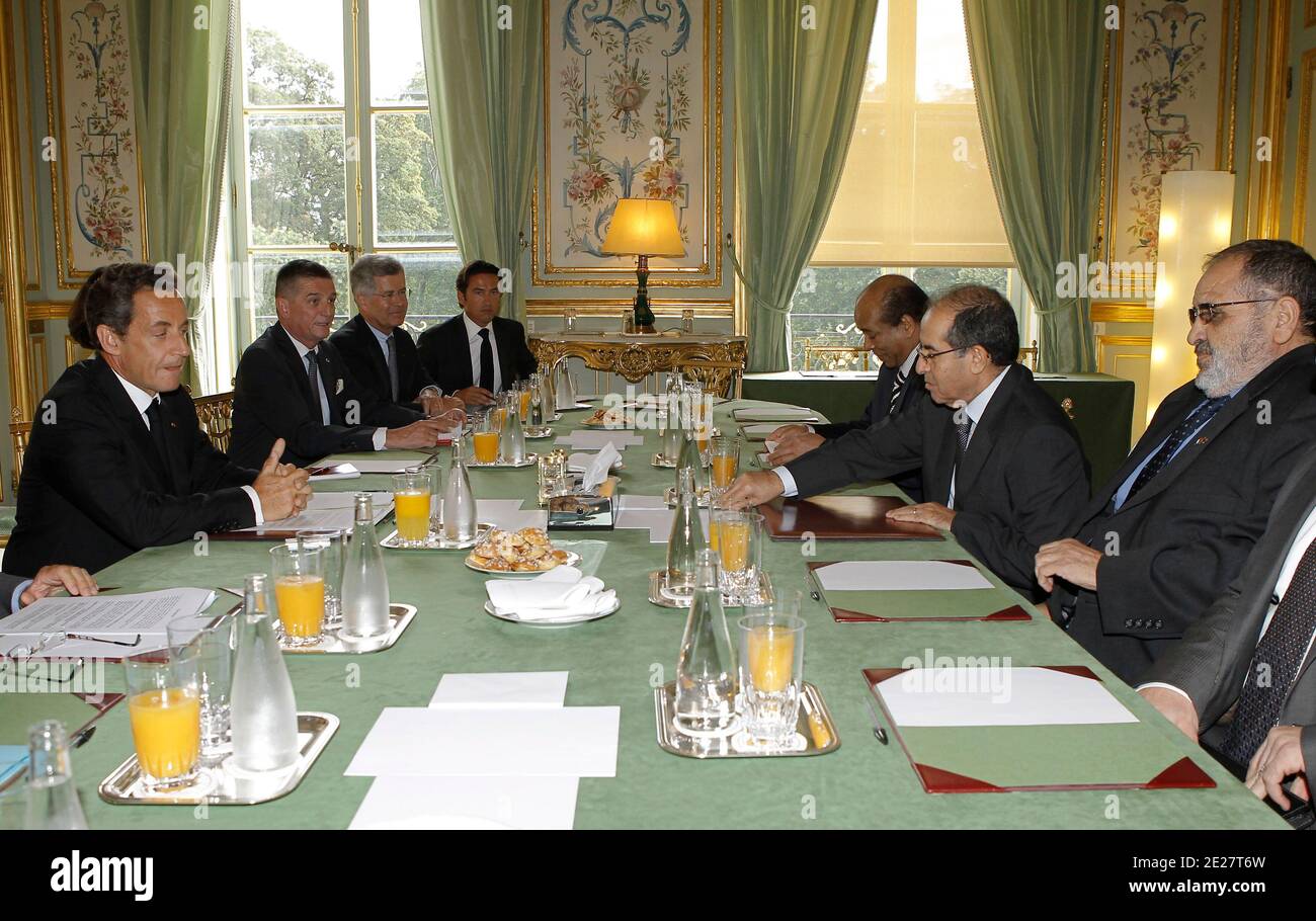 French President Nicolas Sarkozy, left, flanked by Mahmoud Jibril ,2nd rigth, head of the Libyan rebels' acting Cabinet attend their meeting at the Elysee Palace in Paris, France on August 24, 2011. Sarkozy will meet in the evening with Mahmoud Jibril, head of the Libyan rebels' acting Cabinet, for talks on 'the situation in Libya and the international community's actions to support the political transition to a free and democratic Libya,' according to a statement from Sarkozy's office. Photo by Jacques Brinon/Pool/ABACAPRESS.COM Stock Photo