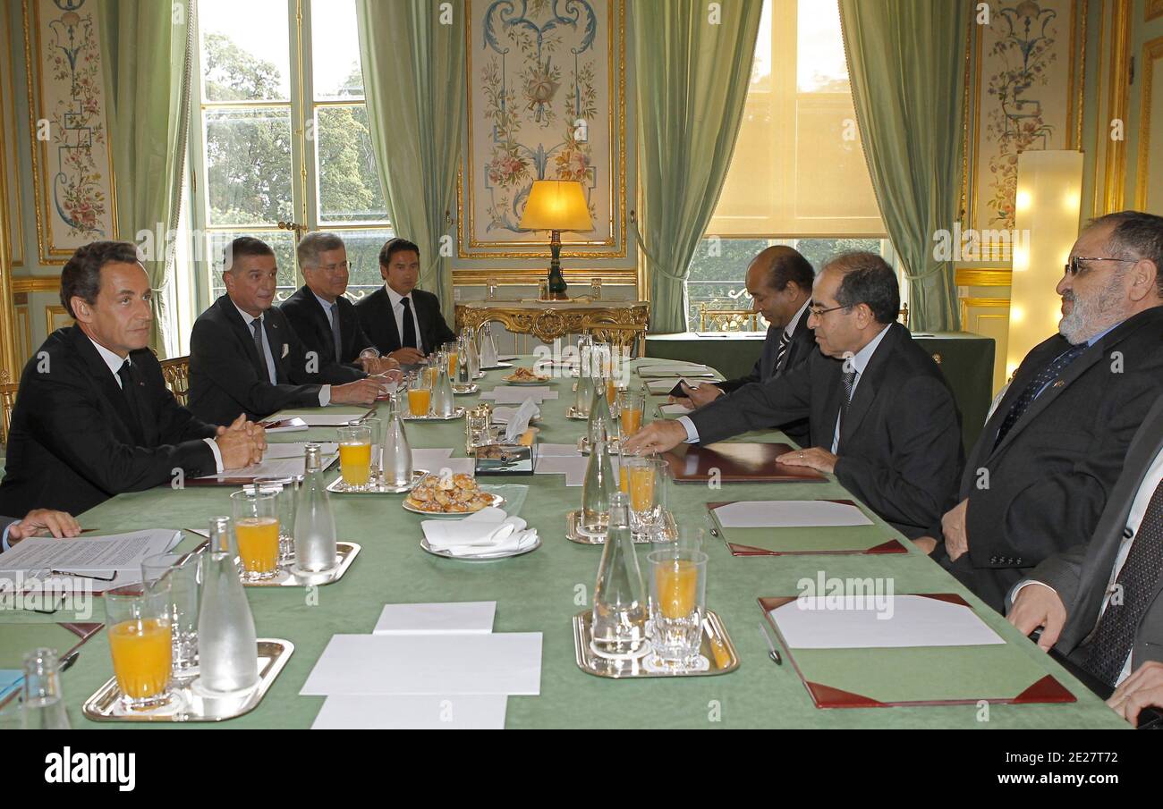 French President Nicolas Sarkozy, left, flanked by Mahmoud Jibril ,2nd rigth, head of the Libyan rebels' acting Cabinet attend their meeting at the Elysee Palace in Paris, France on August 24, 2011. Sarkozy will meet in the evening with Mahmoud Jibril, head of the Libyan rebels' acting Cabinet, for talks on 'the situation in Libya and the international community's actions to support the political transition to a free and democratic Libya,' according to a statement from Sarkozy's office. Photo by Jacques Brinon/Pool/ABACAPRESS.COM Stock Photo