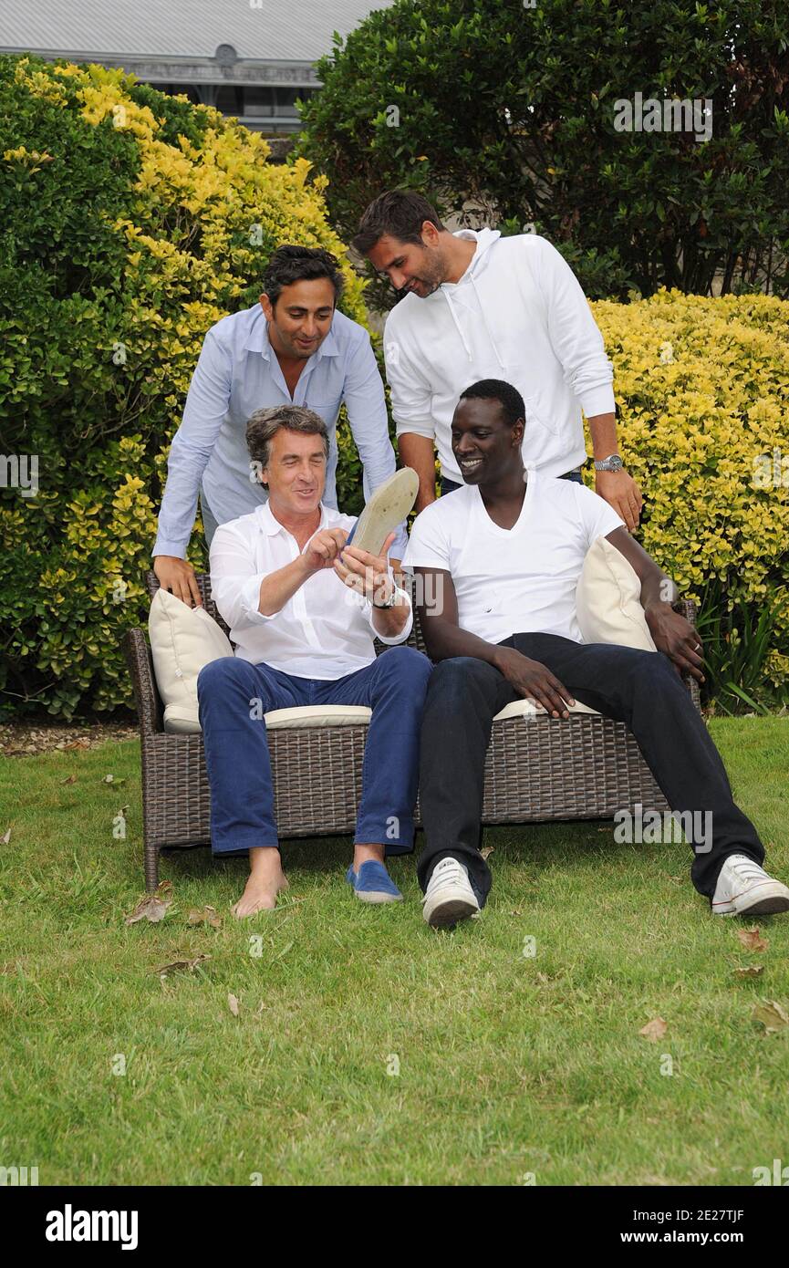 Directors Olivier Nakache, Eric Toledano with actors Francois Cluzet and Omar Sy pose for a the photocall ' Intouchable' during the 4th Festival Du film Francophone d'Angouleme in Angouleme, France on August 25, 2011 . Photo by Giancarlo Gorassini/ABACAPRESS.COM Stock Photo