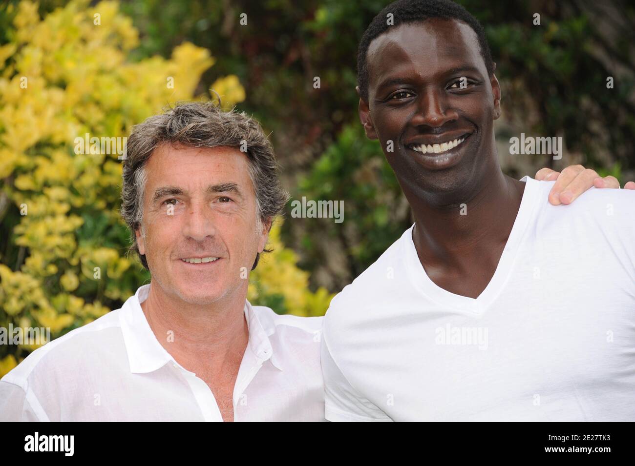Actors Francois Cluzet and Omar Sy pose for a the photocall ' Intouchable' during the 4th Festival Du film Francophone d'Angouleme in Angouleme, France on August 25, 2011 . Photo by Giancarlo Gorassini/ABACAPRESS.COM Stock Photo