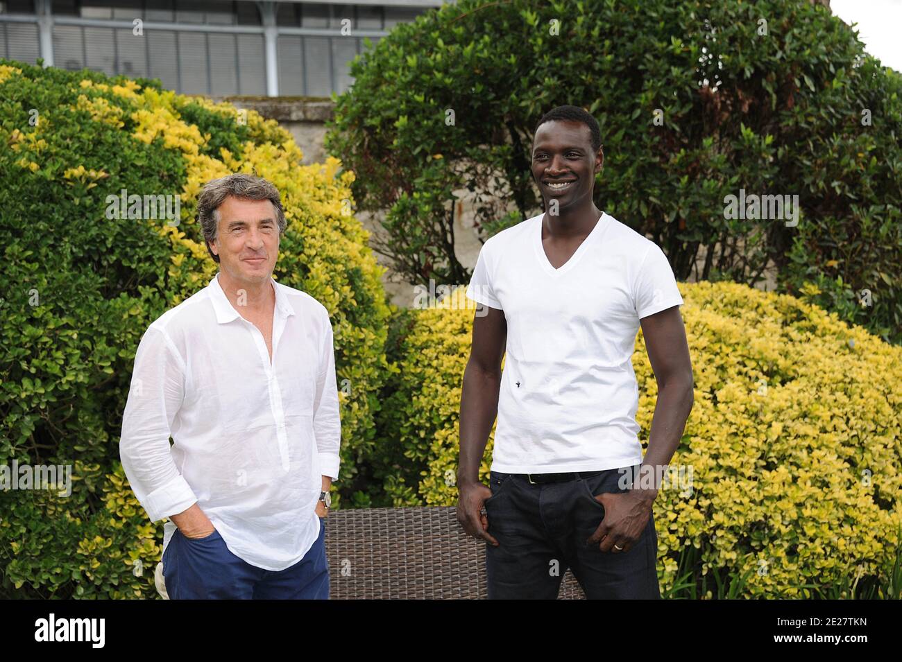 Francois Cluzet and Omar Sy pose for a the photocall ' Intouchable' during the 4th Festival Du film Francophone d'Angouleme in Angouleme, France on August 25, 2011 . Photo by Giancarlo Gorassini/ABACAPRESS.COM Stock Photo