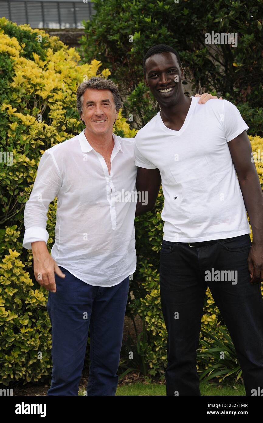 Actors Francois Cluzet and Omar Sy pose for a the photocall ' Intouchable' during the 4th Festival Du film Francophone d'Angouleme in Angouleme, France on August 25, 2011 . Photo by Giancarlo Gorassini/ABACAPRESS.COM Stock Photo