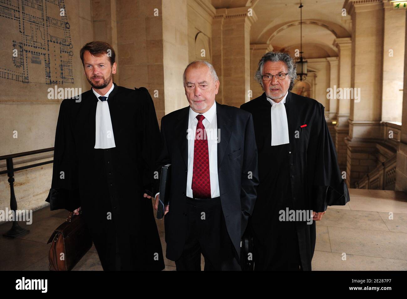 Former French Trade Union Force Ouvriere leader Marc Blondel (C) flanked by  lawyer Jean-Louis Pelletier arrives at the Paris' courthouse, France on  September 5, 2011 for the opening of former France's president