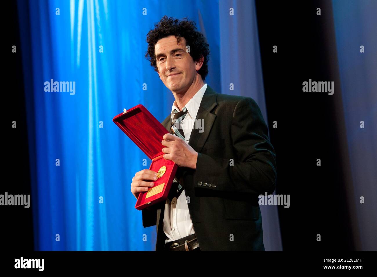 Cinematographer Robbie Ryan holds Osella prize for best cinematography he received for Cinematographer Robbie Ryan holds Osella prize for best cinematography he received for