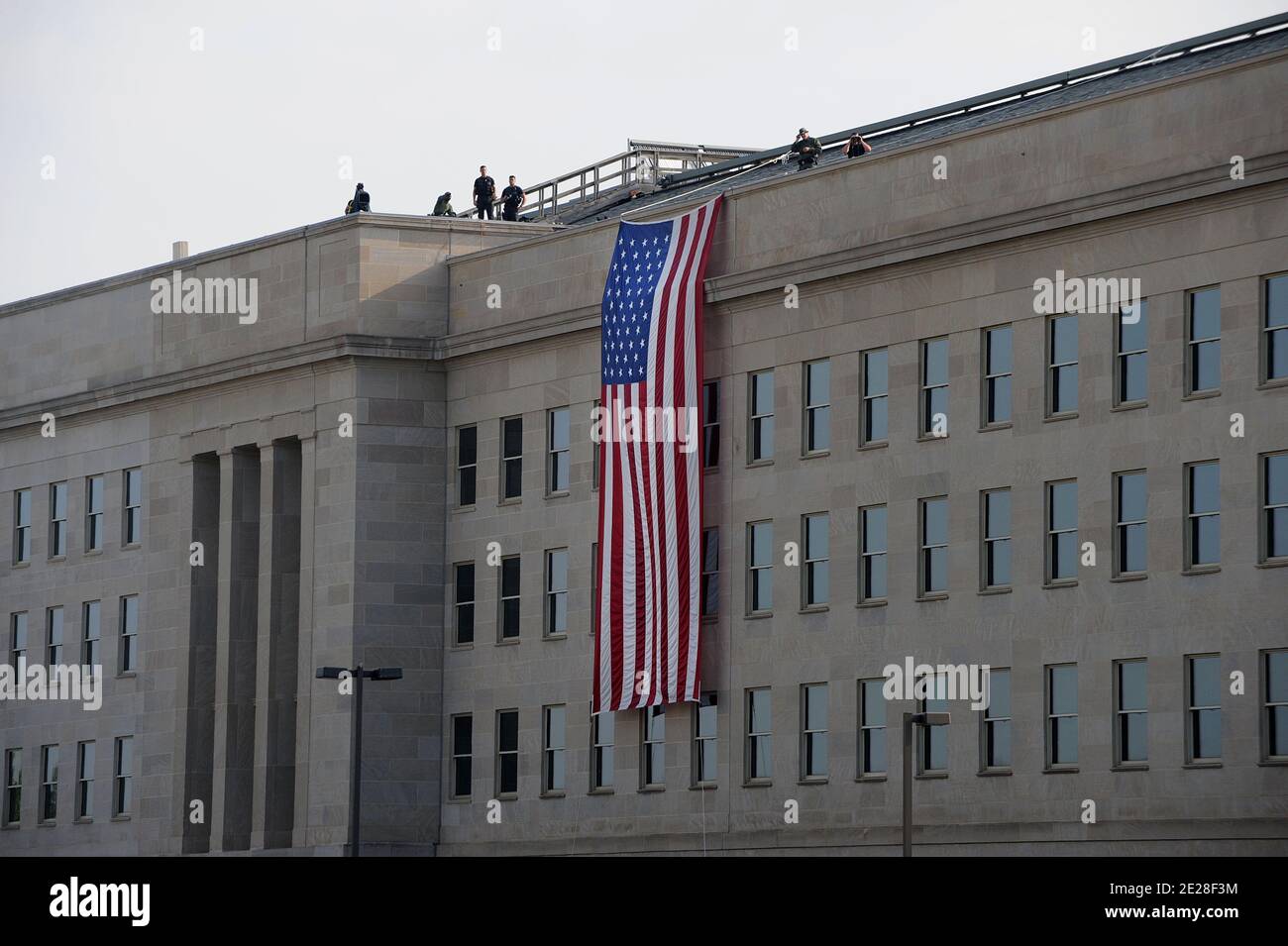 A huge American flag hangs at the point of impact at the Pentagon on the 10th anniversary of 9/11 2001 terrorist attacks on September 11, 2011 in Arlington, VA, USA,. Photo by Olivier Douliery/ABACAPRESS.COM Stock Photo