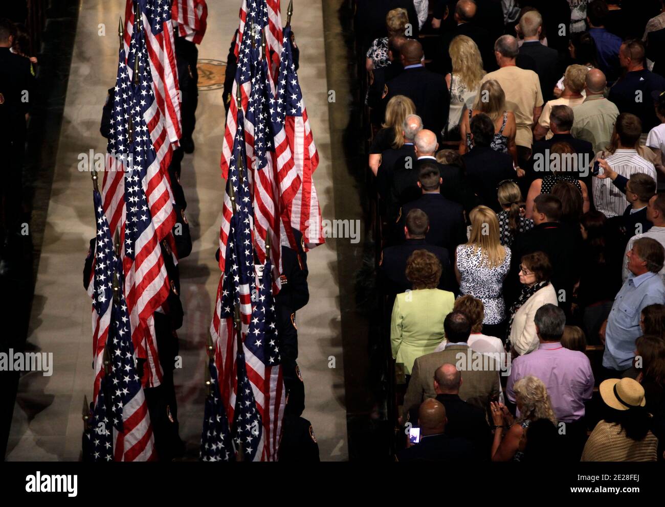 Firefighters leave St. Patrick's Cathedral with American flags in New York Saturday, Sept. 10, 2011, during a ceremony to honor New York firefighters who were killed ten years ago in the attacks on the World Trade Center. (AP Photo/Seth Wenig, Pool) Photo pool/ABACAPRESS.COM Stock Photo