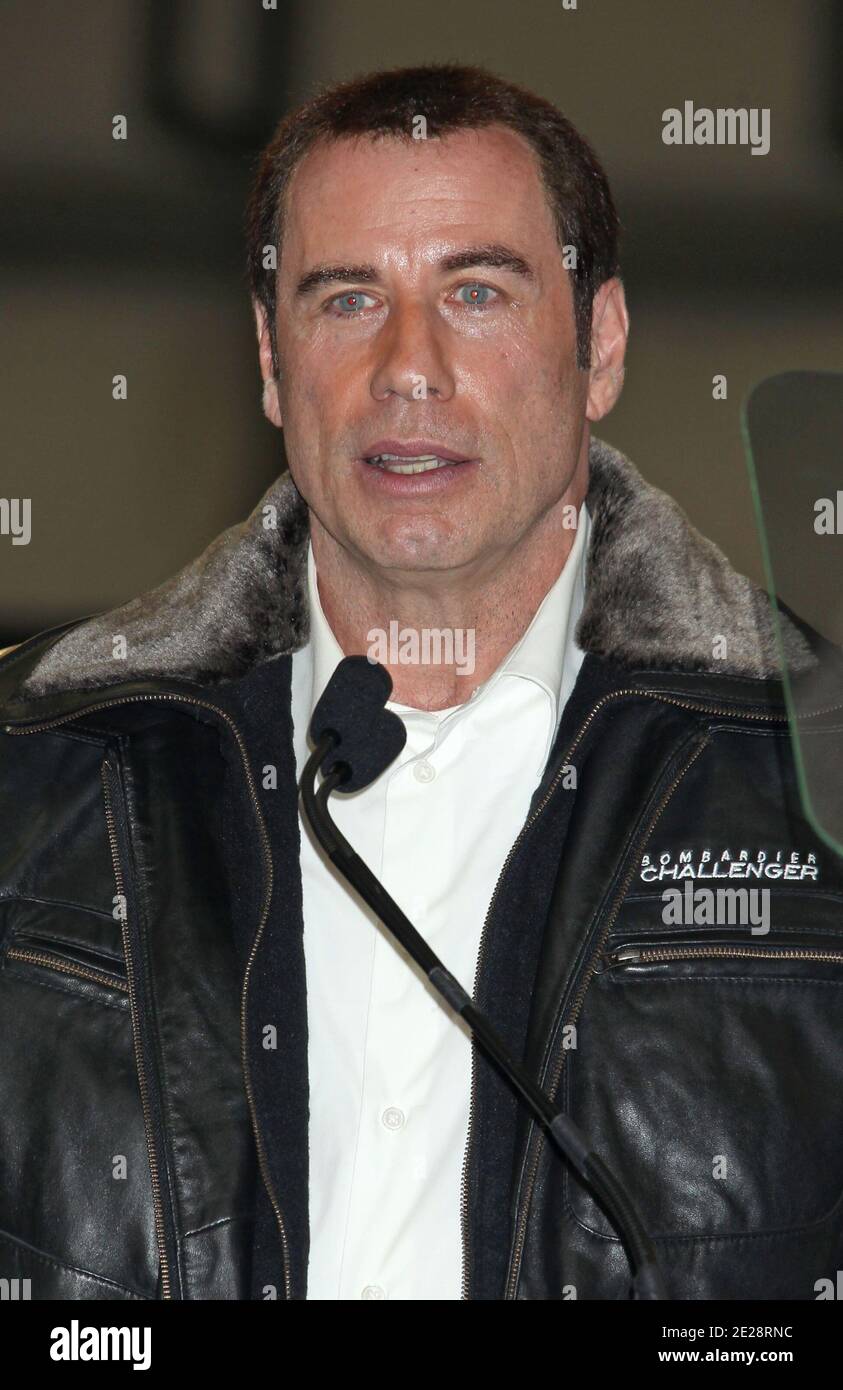John Travolta, Bombardier Aircraft introduce their latest Aircraft, The Lear Jet, The Challenger, and The Global 5000 Jets in Hangar 25 at the Burbank Airport, in Los Angeles California, USA, September 20, 2011. Photo by Baxter/ABACAPRESS.COM Stock Photo