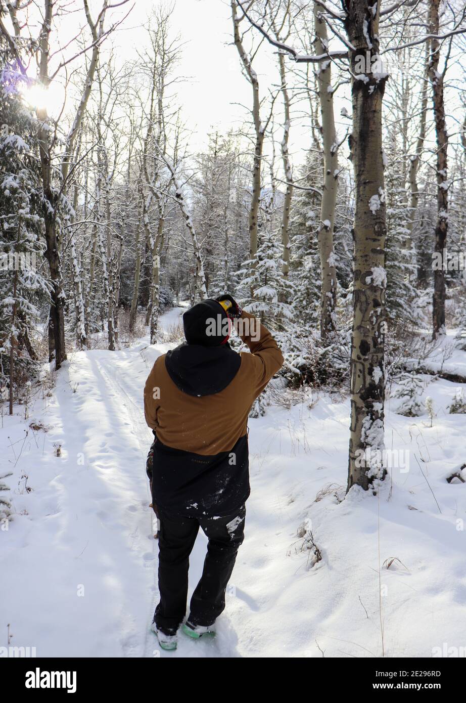 a man taking a quick drink in his favourite season Stock Photo