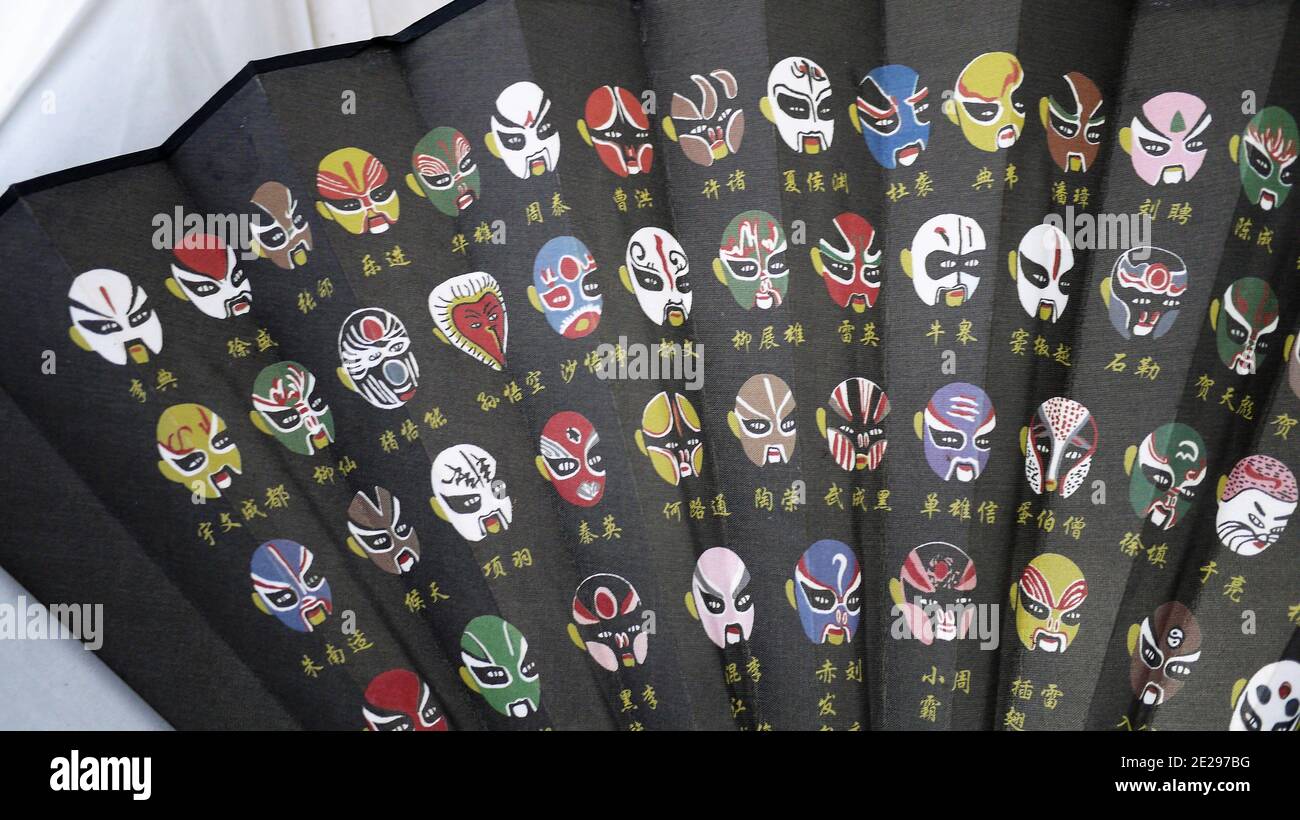 traditional fan with drawings of Chinese opera masks Stock Photo