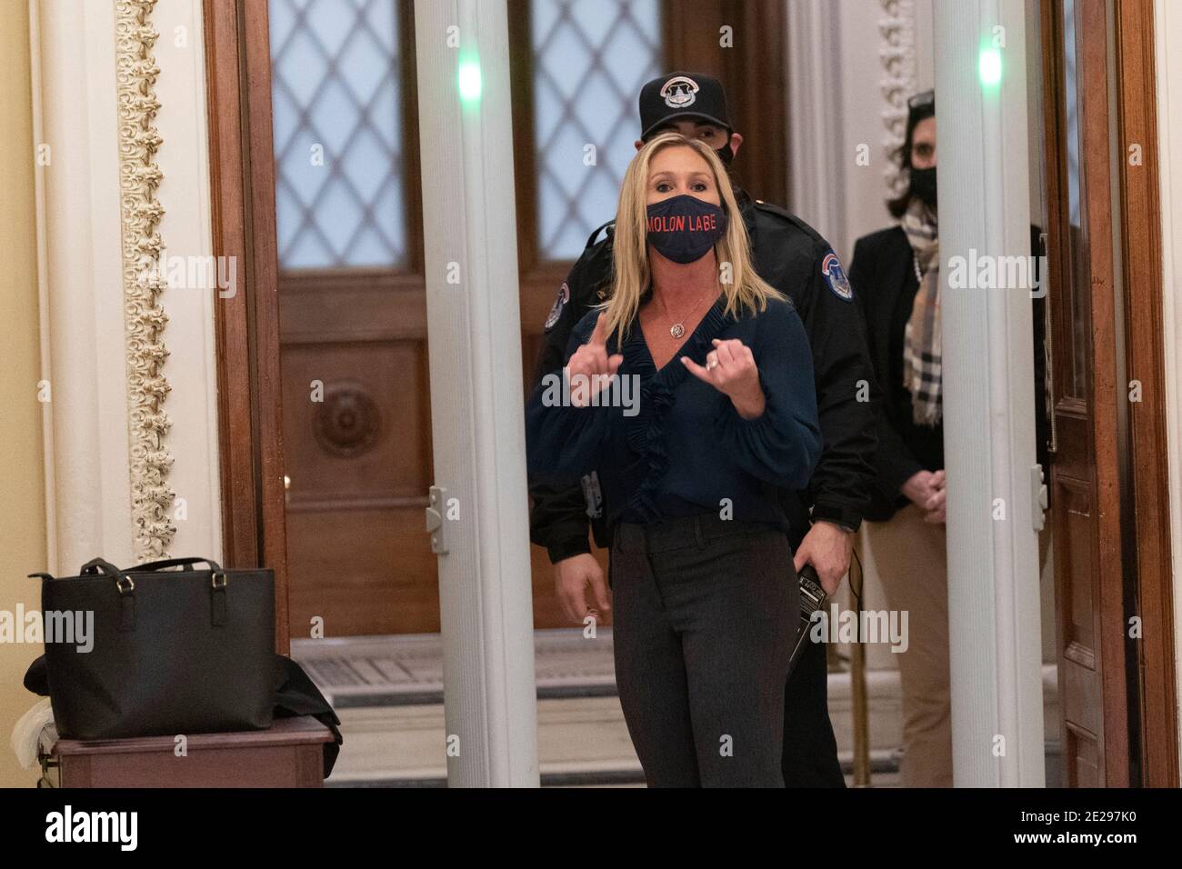 12 January 2021- Washington DC- Representative Marjorie Taylor Greene(R-GA) yells at journalists as she passes through a newly installed metal detector outside the House Chamber. Photo Credit: Chris Kleponis/Sipa USA Stock Photo