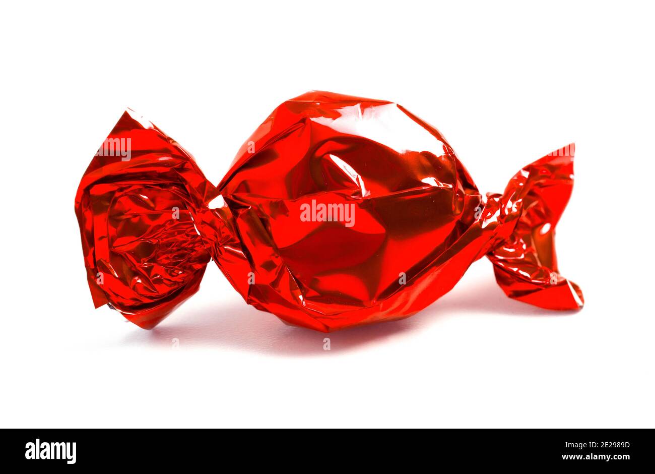 Single Wrapped Red Candy Isolated on a White Background Stock Photo - Alamy