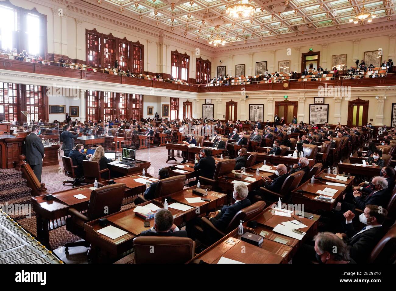 Austin, Texas January 12, 2021: Lawmakers gather in the Texas House chamber for the opening of the 87th session of the Texas Legislature. Lawmakers are facing a huge deficit due to the coronavirus pandemic. Credit: Bob Daemmrich/Alamy Live News Stock Photo