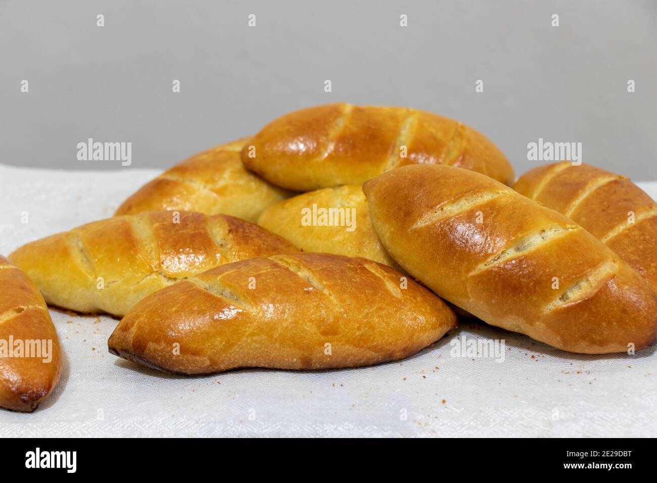 Traditional Russian pastry. Russian pirozhki, homemade baked patties. Stock Photo