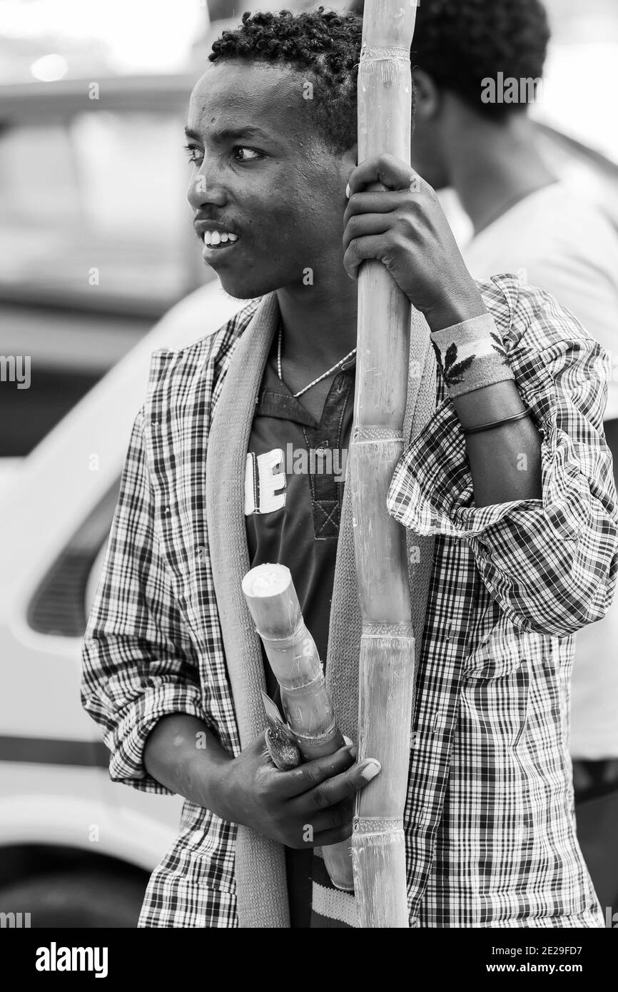 ADDIS ABABA, ETHIOPIA - Jan 05, 2021: Addis Ababa, Ethiopia, January 27, 2014, Man selling sugarcane on the street Stock Photo