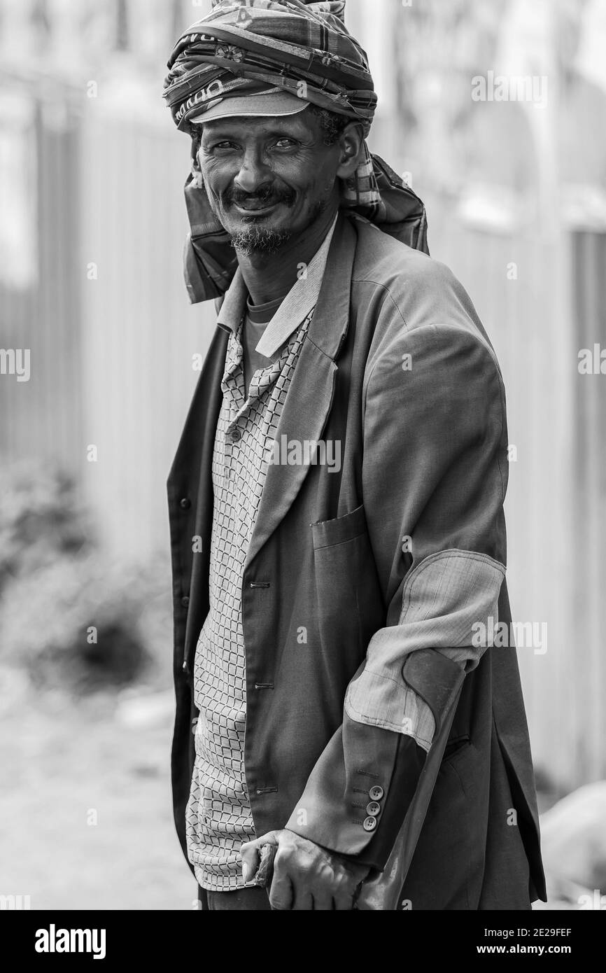 ADDIS ABABA, ETHIOPIA - Jan 05, 2021: Addis Ababa, Ethiopia, January 27, 2014, Old Arabic man using crutches and smiling at camera Stock Photo