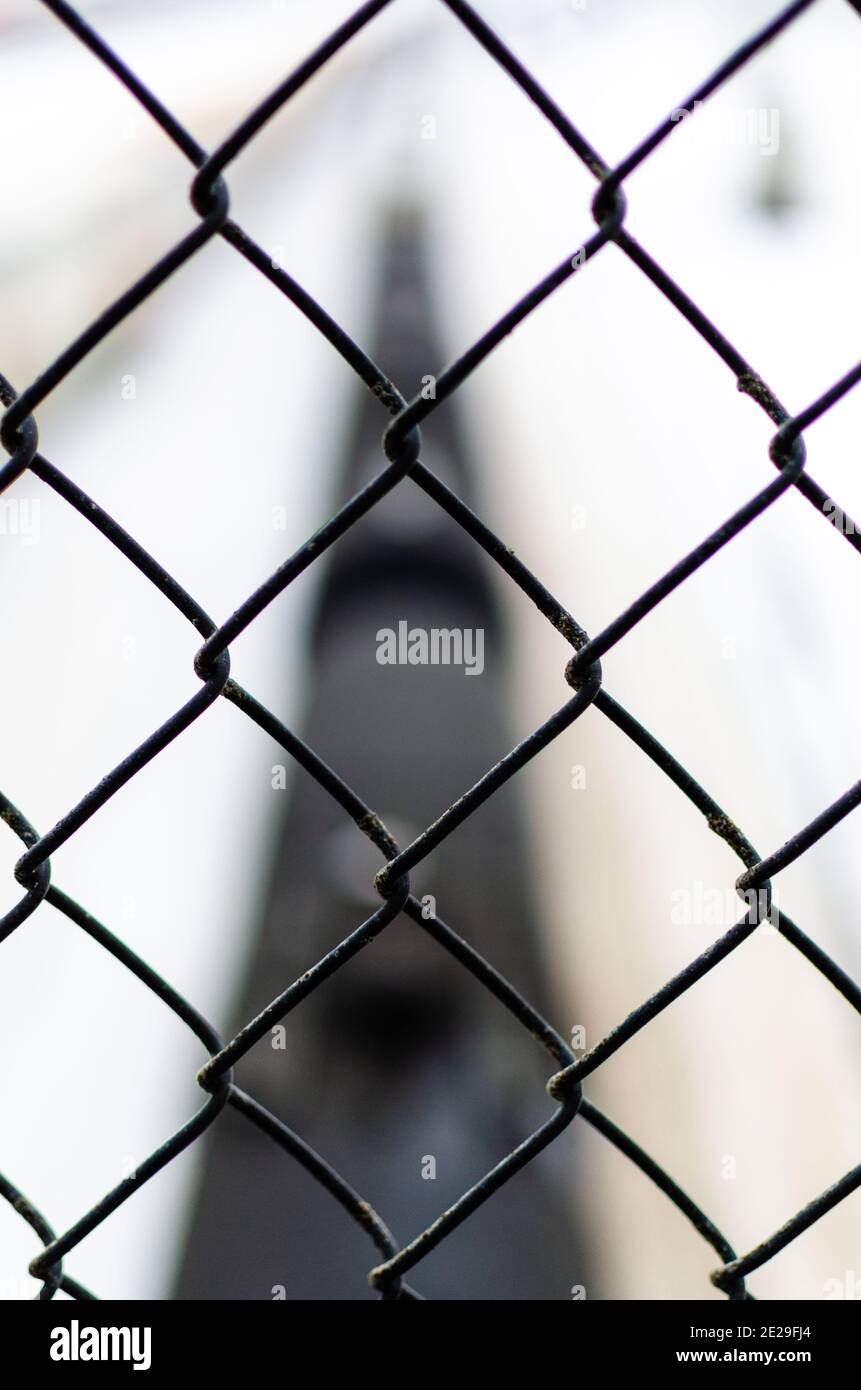 Close up of a chain-link fence with a blurry cargo chain in the background  in Winnipeg, Manitoba, Canada Stock Photo - Alamy
