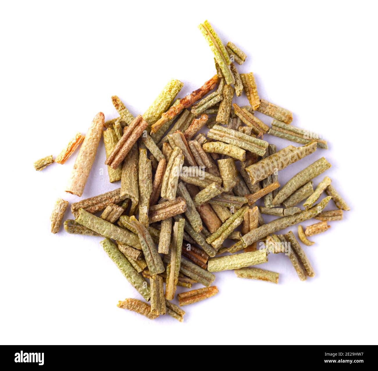Pile of dried rosemary leaves isolated on white background. Macro photo