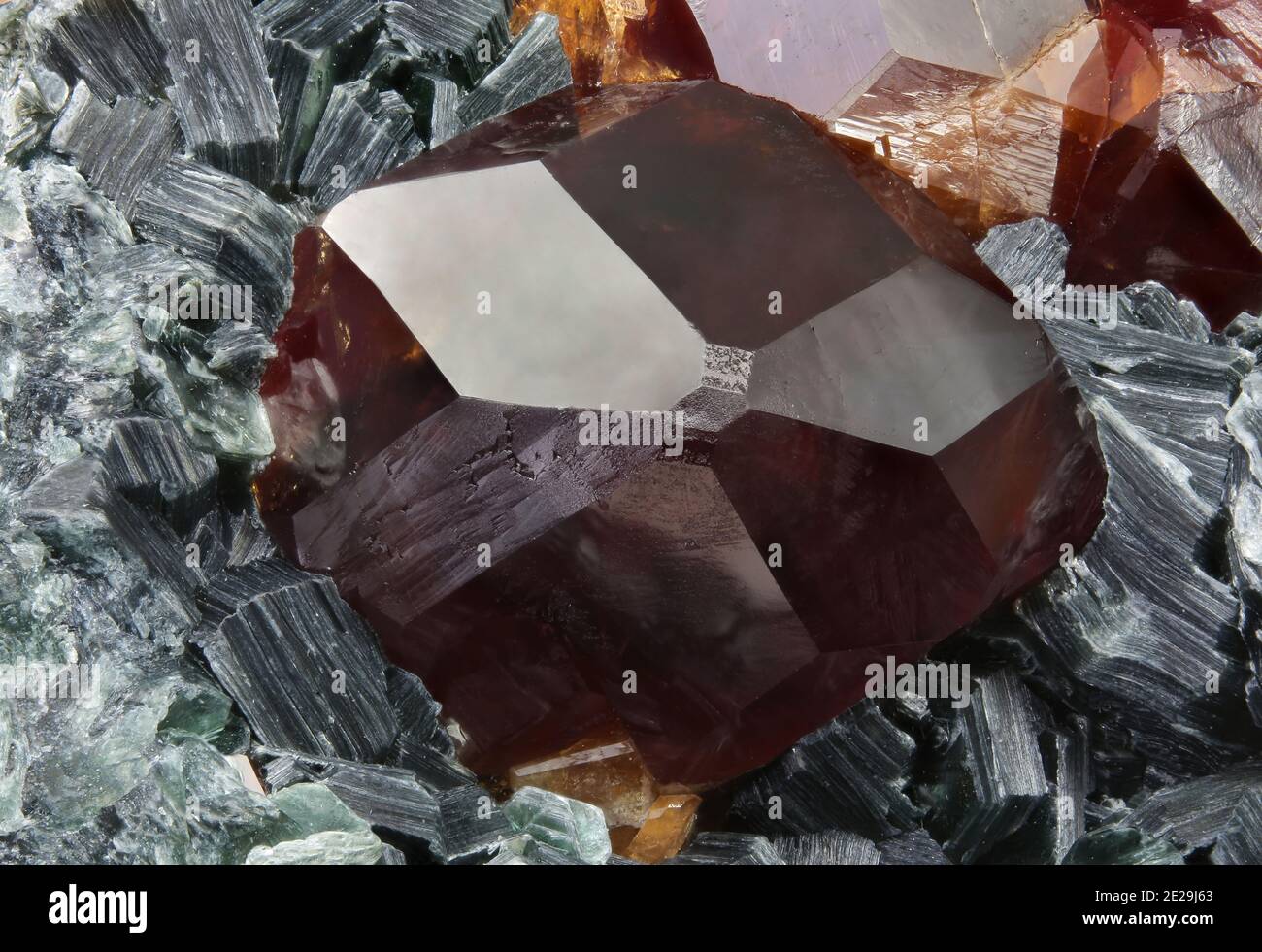 Grossular (Var: Hessonite) - Laietto, Condove, Metropolitan City of Turin, Piedmont, Italy - 8.74 mm Hessonite crystal. Stock Photo