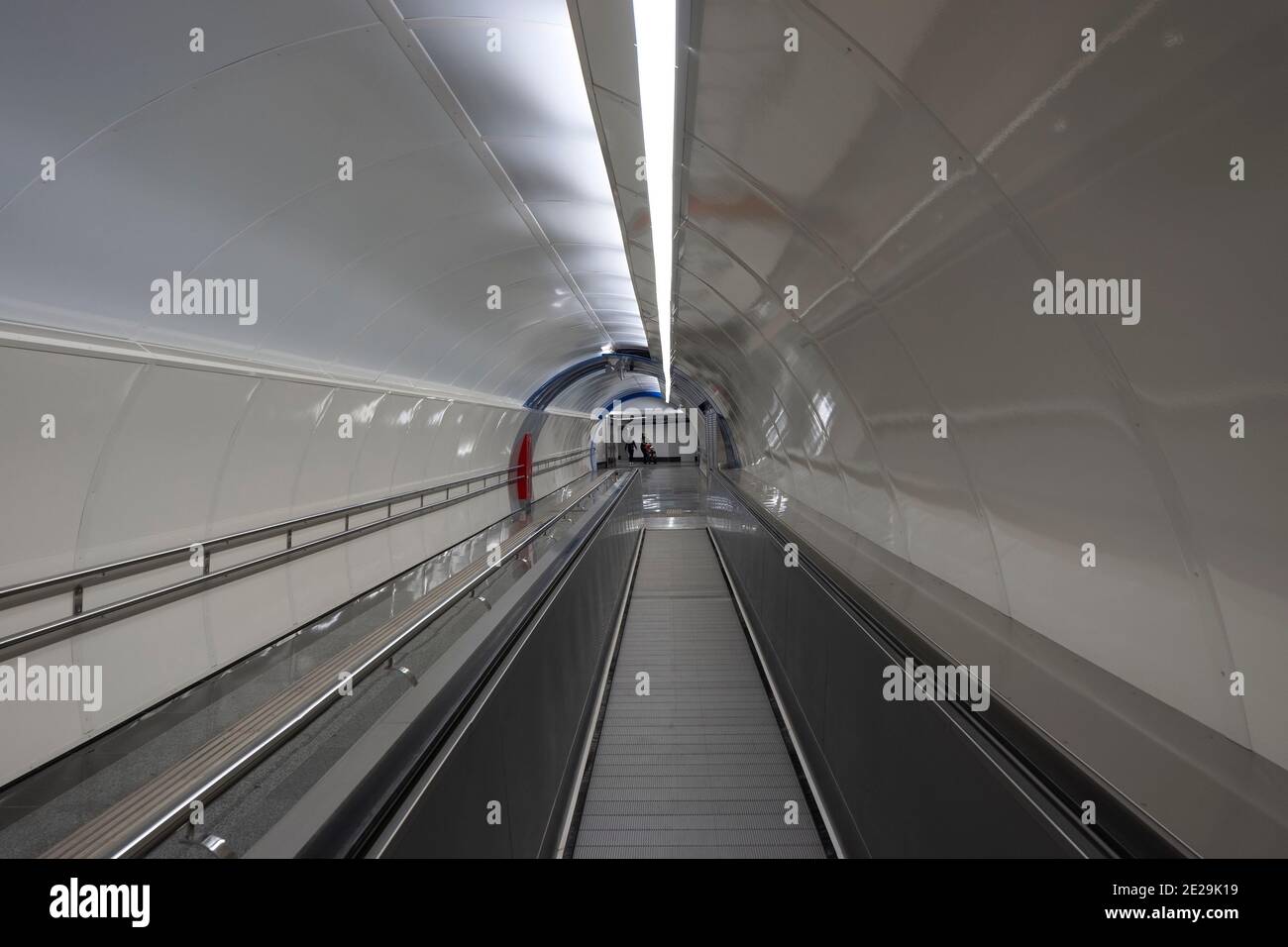 Passenger conveyor for moving people between stations Stock Photo Alamy