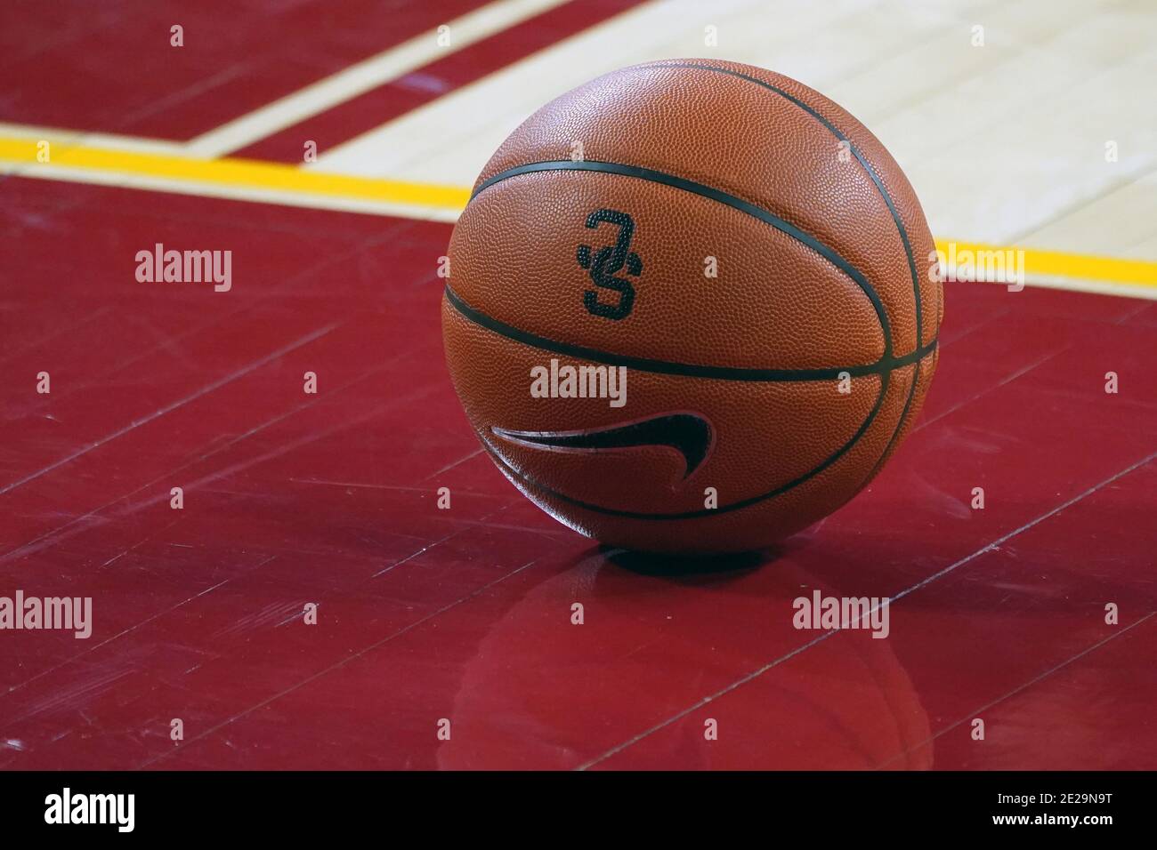 Basketball swooshes through a basketball hoop during a basketball