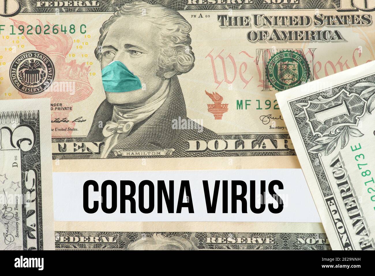 Dollar bill, protective mask and coronavirus Stock Photo