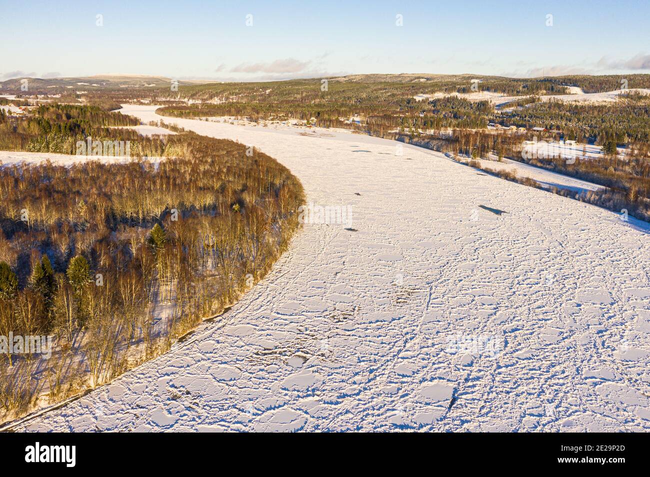 The Klarälven river frozen over just before a dam Stock Photo