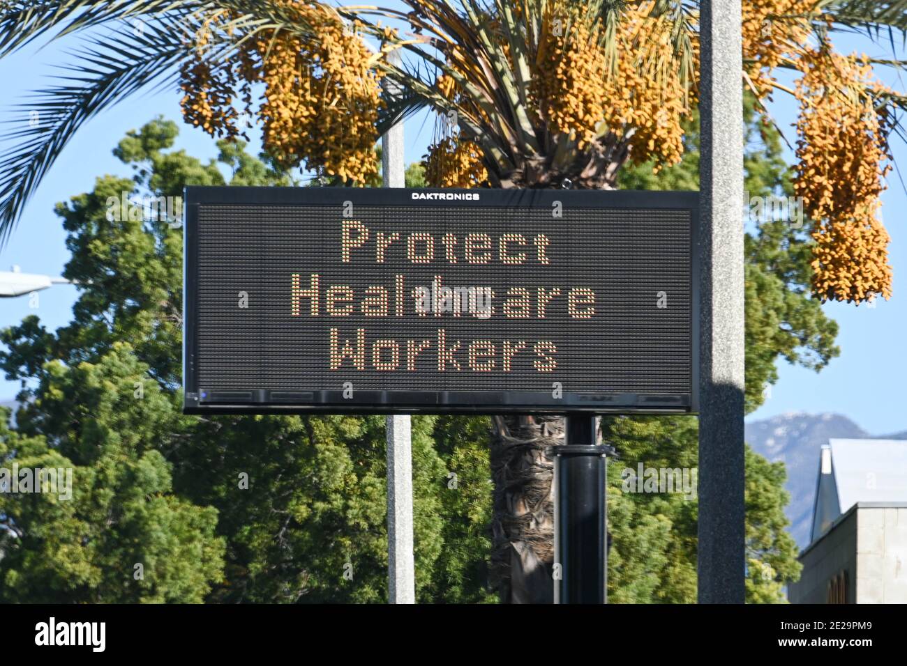 A message board is illuminated reading “Protect Healthcare Workers”, Saturday, Jan. 2, 2021, in Pasadena, Calif. (Dylan Stewart/Image of Sport) Stock Photo