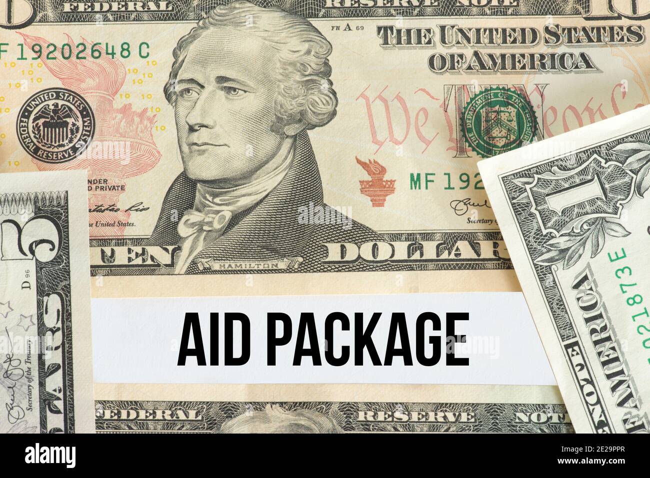 Dollar bills and aid package for coronavirus in America Stock Photo