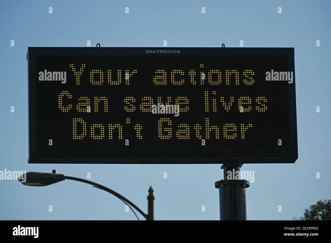 A message board is illuminated reading “Your actions can save lives don’t gather”, Saturday, Jan. 2, 2021, in Pasadena, Calif. (Dylan Stewart/Image of Stock Photo
