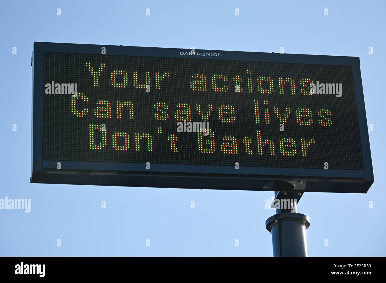 A message board is illuminated reading “Your actions can save lives don’t gather”, Saturday, Jan. 2, 2021, in Pasadena, Calif. (Dylan Stewart/Image of Stock Photo