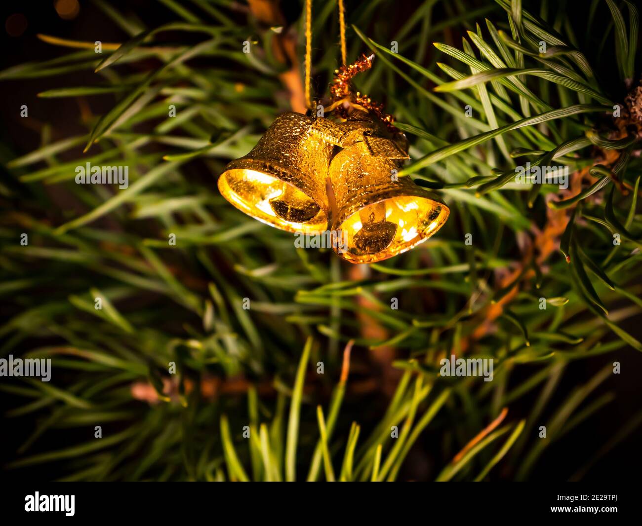 Golden bells decoration of the Christmas tree. Merry Christmas. New