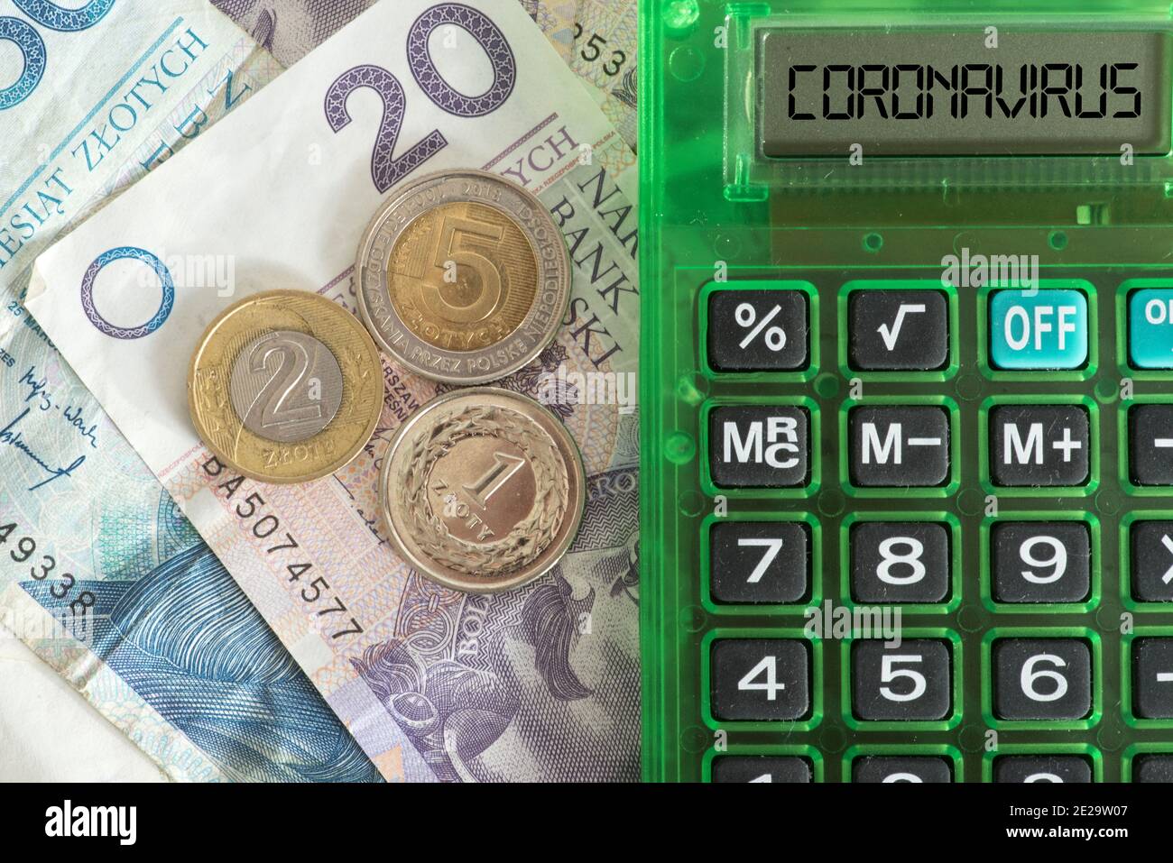 Money Polish zloty PLN, calculator and cost of coronavirus Stock Photo