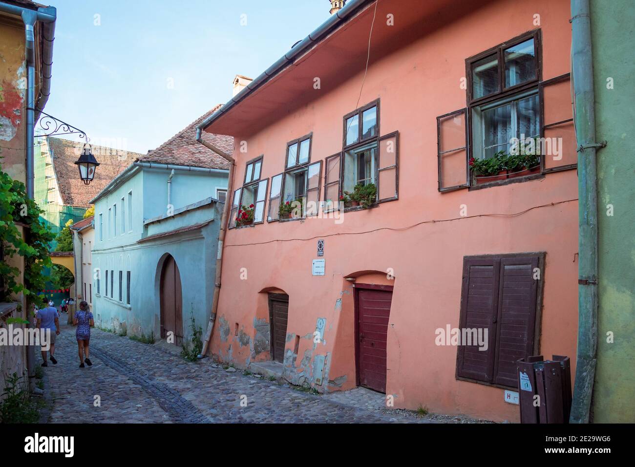 Beautiful colorful street in Sighisoara in typical traditional style Stock Photo