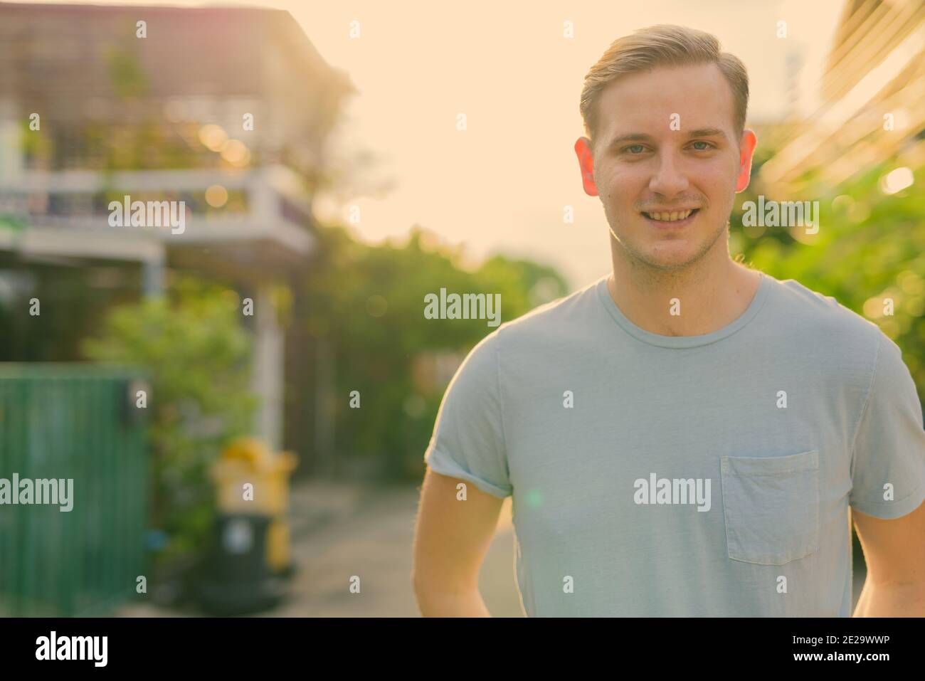 Young handsome man with blond hair in the streets outdoors Stock Photo ...