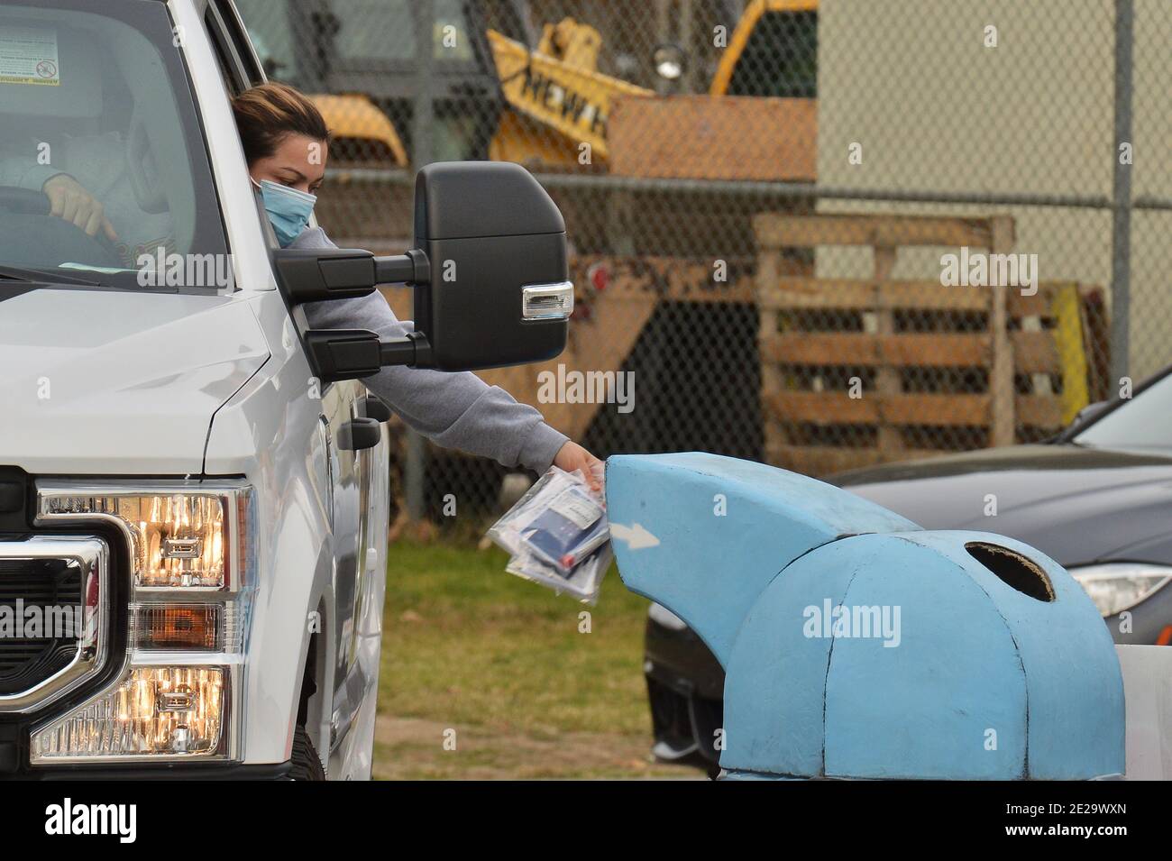 Los Angeles, California, USA. 13th Jan, 2021. Los Angeles, United States. 13th Jan, 2021. Residents deposit their Curative coronavirus test in a receptacle at the Hansen Dam testing site in Los Angeles on Tuesday, January 12, 2021. Los Angeles County health officials said Sunday they will stop providing the commonly used coronavirus test after federal regulators raised questions about its accuracy, saying the test made by Curative carries a "risk of false results, particularly false negative results." Photo by Jim Ruymen/UPI Credit: UPI/Alamy Live News Credit: UPI/Alamy Live News Stock Photo