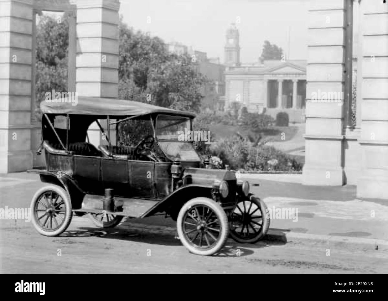 Vintage black and white photograph with the caption T-model Ford car parked outside Geelong Library at its launch in 1915. Stock Photo