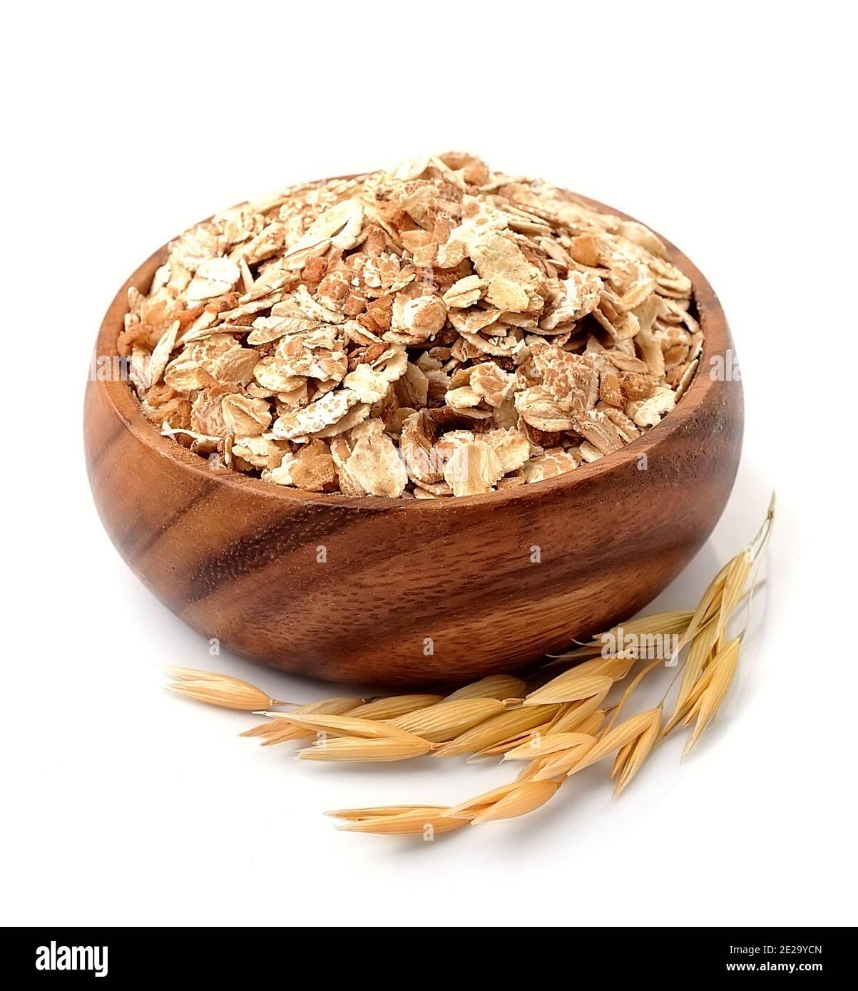 Oat flakes in bowl isolated on white backgrounds . Oat porridge.Oats harvest . Oat grain sack. Ears of oats. Stock Photo