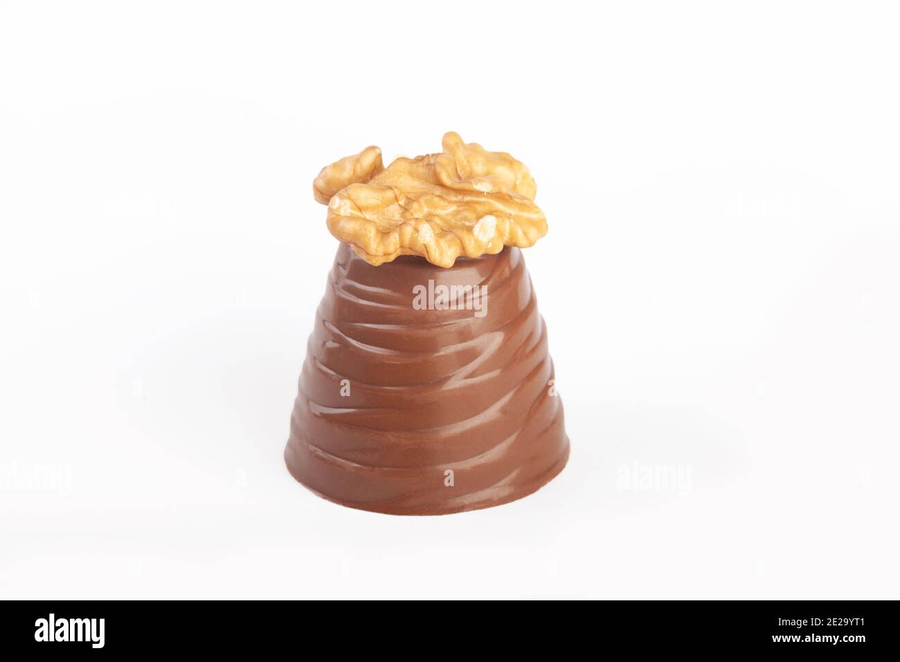 A milk chocolate walnut whip against a white background Stock Photo Alamy
