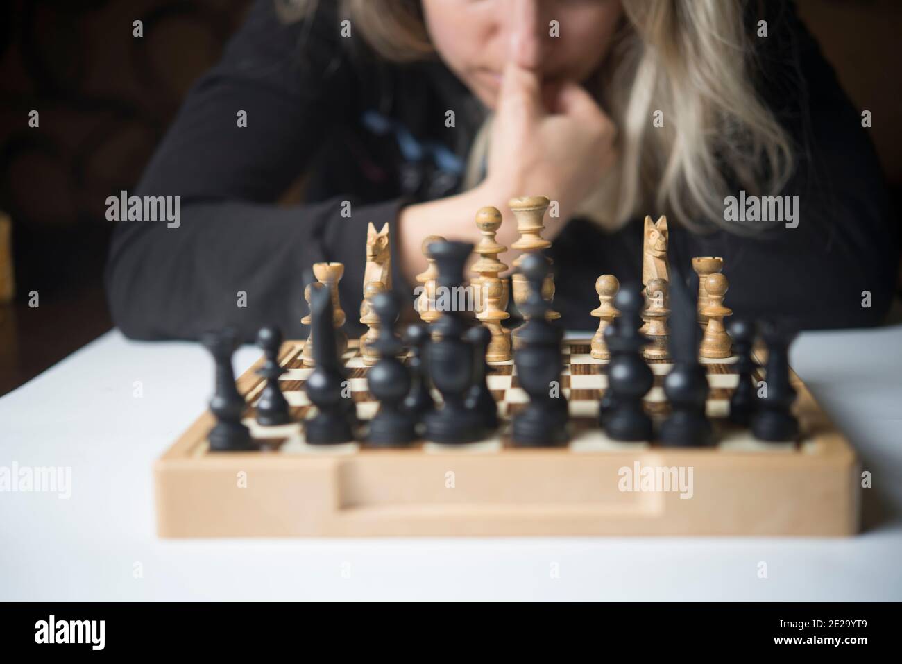Businesswoman thinking how to play chess concept business strategy for win  Stock Photo - Alamy
